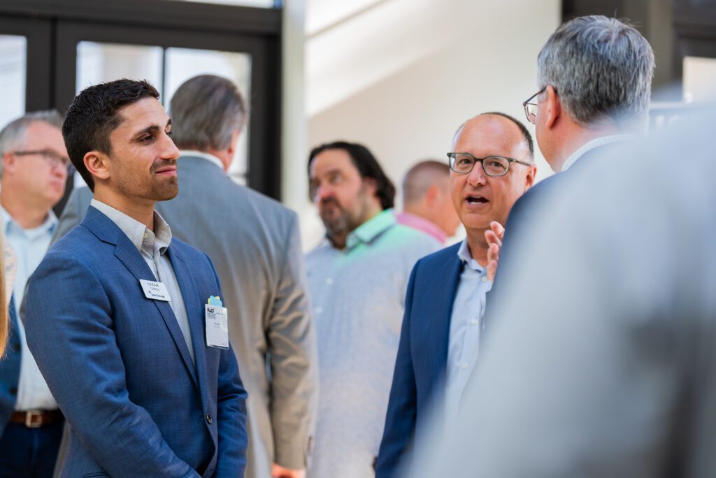 Attendees networking and talking at a corporate event